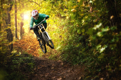 Mountainbiker rides in autumn forest © KopoPhoto - Fotolia.com